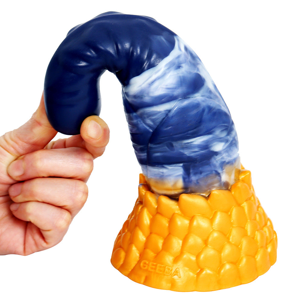 hand bending flexible blue tentacle dildo shaft above gold scaled base