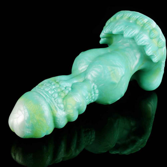 side view of cyan dragon dildo showing fanned scale ridges