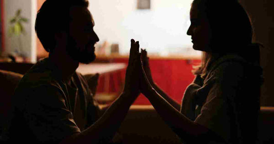 couple sitting together talking indoor