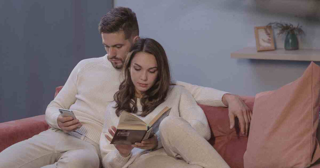 couple reading book cozy