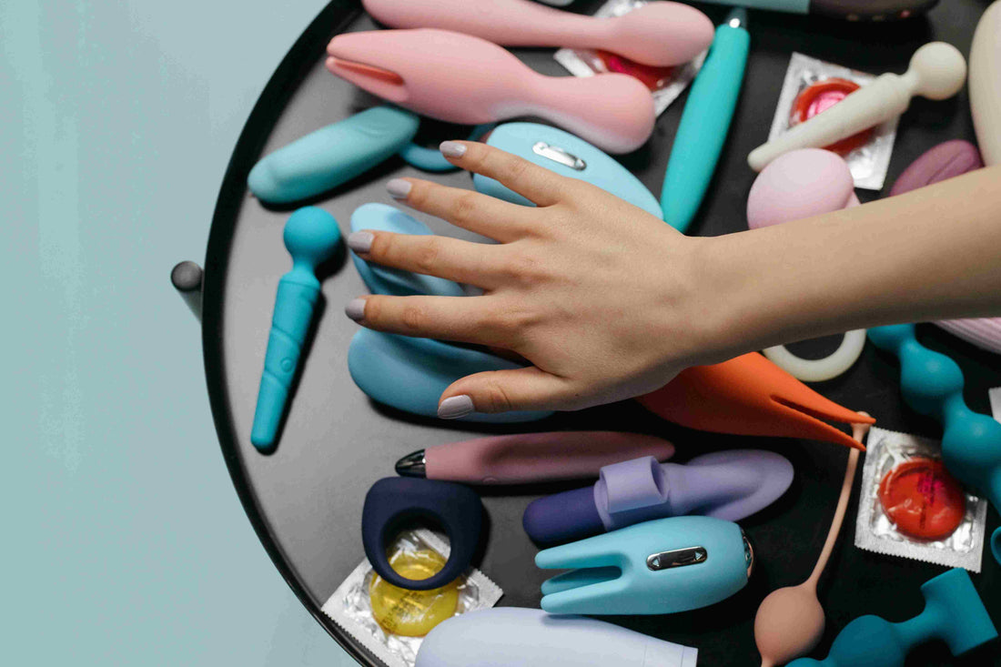 flat lay of assorted body-safe intimate toys on a tray for couples intimacy
