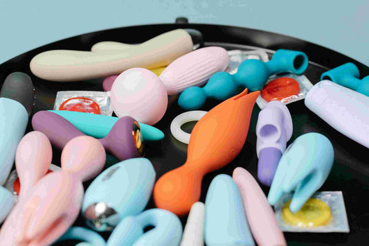 assortment of colorful compact mini silicone wellness accessories neatly arranged on a modern tray