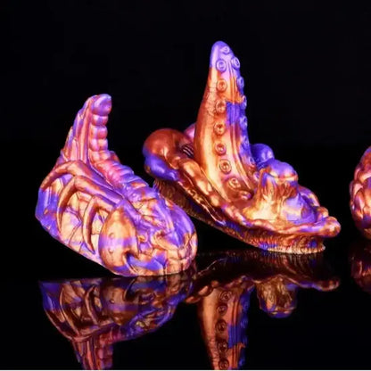 fantasy creature textured silicone dildos in metallic purple and copper shimmer finish