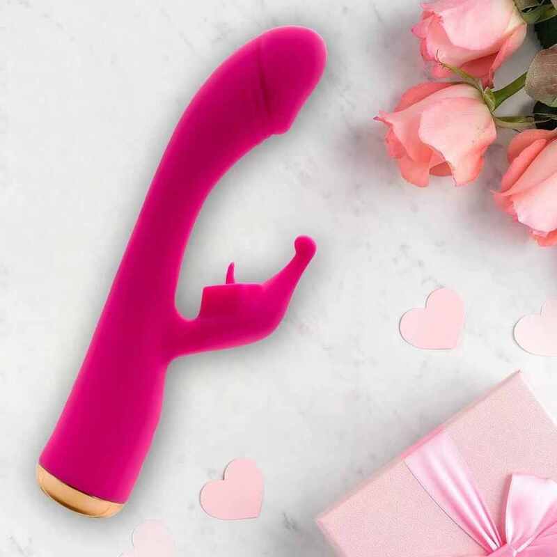 radiant red rabbit vibrator flat lay on marble background with pink roses and gift box