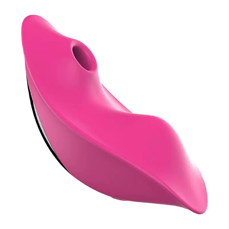 side view of rose red wearable panty vibrator showing contoured body and clitoral suction nozzle
   